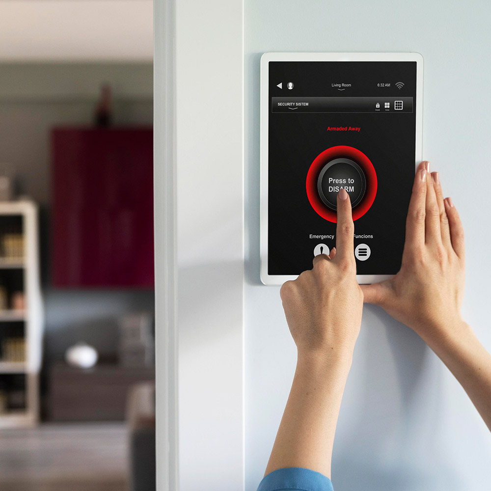 Security and Safety Interior wall-mounted touchscreen console used for monitoring home security status and disarming the alarm system, installed by AP Plumbing and Electrical Services