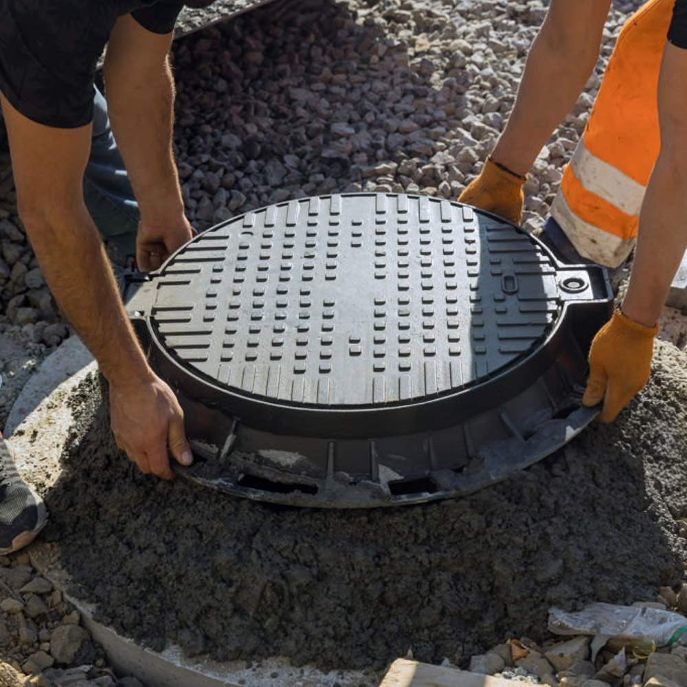 Toilet Plumbing Plumber servicing or repairing a residential septic tank system, highlighting expert septic plumbing and maintenance services from AP Plumbing and Electrical Services