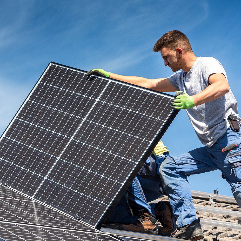 Power Outage AP Plumbing and Electrical Services team installing a new solar panel onto a residential rooftop for renewable energy generation